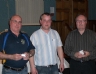 Club Chairman Brian O'Neill presents quiz masters Joe Crawford and Danny Mc Larnon with their commemorative 125 medals 